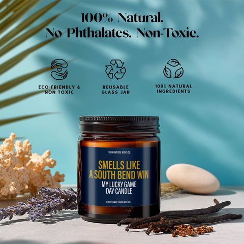 Candle styled with lavender, vanilla pods, and eco symbols highlighting features like 100% natural soy wax, phthalate-free fragrance, and a reusable amber jar—eco-conscious meets game day spirit.
