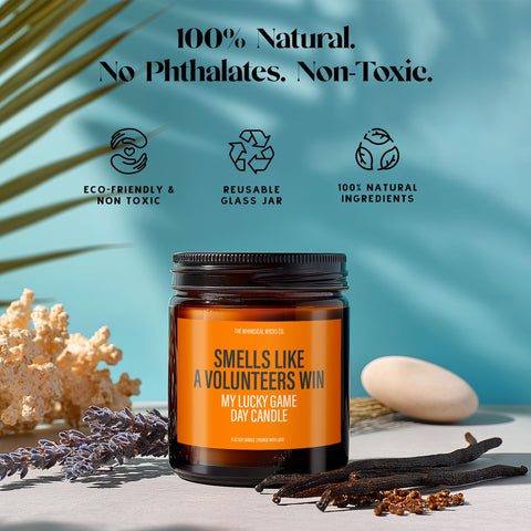 Visual breakdown highlighting sustainable features like 100% soy wax, lead-free cotton wick, reusable amber glass jar, and clean-burning fragrance oils. The “Smells Like A Volunteers Win” label stands front and center, appealing to eco-conscious sports fans who want to light one up after a touchdown while staying planet-friendly.