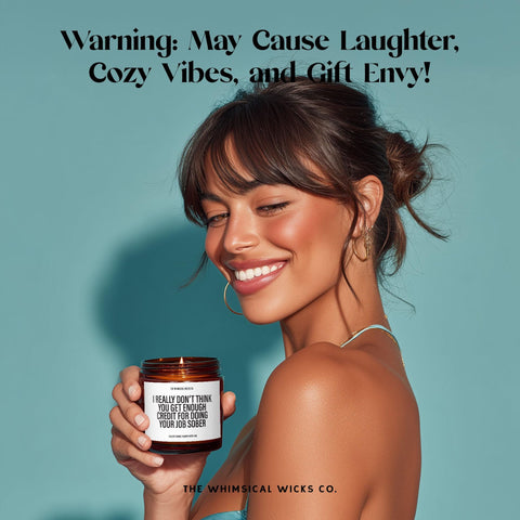 Smiling woman holding a 9oz candle with the bold label: βI really donβt think you get enough credit for doing your job sober.β Caption above reads: βWarning: May Cause Laughter, Cozy Vibes, and Gift Envy!β Perfect lifestyle shot for sarcastic gifting and fun candle moments.