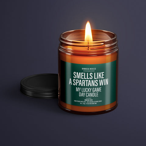 Michigan football candle, natural soy candle, game day scent, sports themed candle, lucky sports candle, Michigan victory aroma, college football candle, handmade soy wax, unique sports gift, eco-friendly candle, Michigan team spirit, football fan