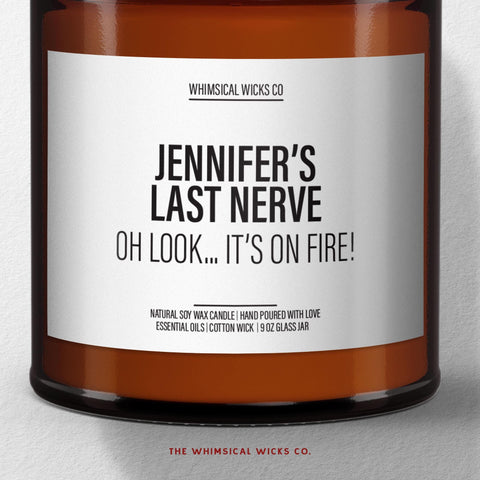 Close-up of candle label reading ‘Jennifer’s Last Nerve – Oh look… it’s on fire!’ showcasing clean typography on customizable adult humor candle.