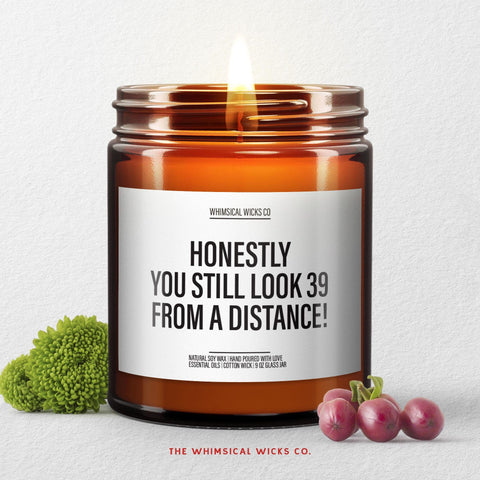 Funny 40th birthday candle with label “Honestly, You Still Look 39 From a Distance” in 9oz amber jar; perfect milestone birthday gag gift.