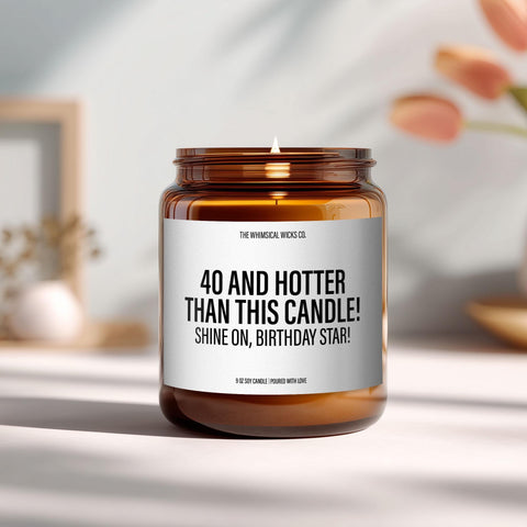 Amber glass candle with bold label that reads “40 and Hotter Than This Candle! Shine On, Birthday Star!” styled on a modern tabletop with soft natural lighting. A cheeky 40th birthday gift for her.