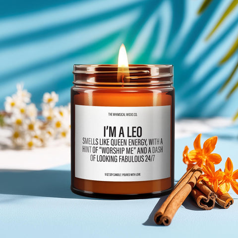 Amber glass jar candle with bold label that reads “I’m a Leo — Smells like queen energy, with a hint of ‘worship me’ and a dash of looking fabulous 24/7” styled on a soft neutral background.