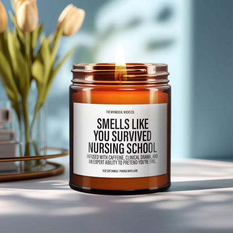 A hand-poured amber jar candle labeled “Smells like you survived nursing school (barely),” lit on a modern tray. The perfect mix of snark and celebration for new nurses, nursing grads, or clinical survivors. A thoughtful and hilarious gift for RN pinning ceremonies or post-exam relief.