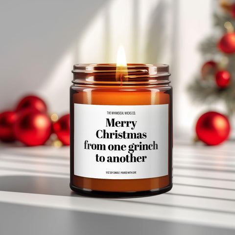 Hero image – 9oz amber glass jar candle
Close-up of a 9oz amber glass jar candle with black metal lid, white label reading “Merry Christmas from One Grinch to Another” in bold black text, styled on a neutral background with warm lighting, perfect for sarcastic and Grinch-themed holiday gifting.