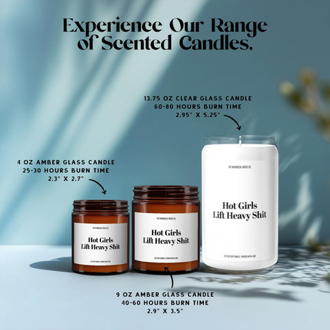 Amber 4oz and 9oz glass jar candles plus a 13.75oz clear glass jar candle, all labeled “Hot Girls Lift Heavy Shit,” shown together to highlight size options for customers wanting cheeky gym candles.